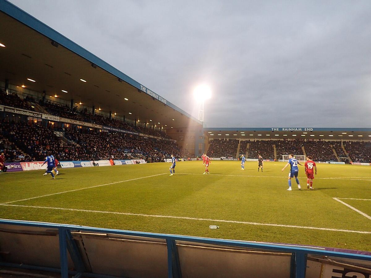 A football match being played in a large stadium