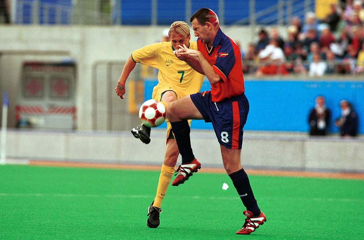 A footballer striking the ball during a match at Sydney 2000