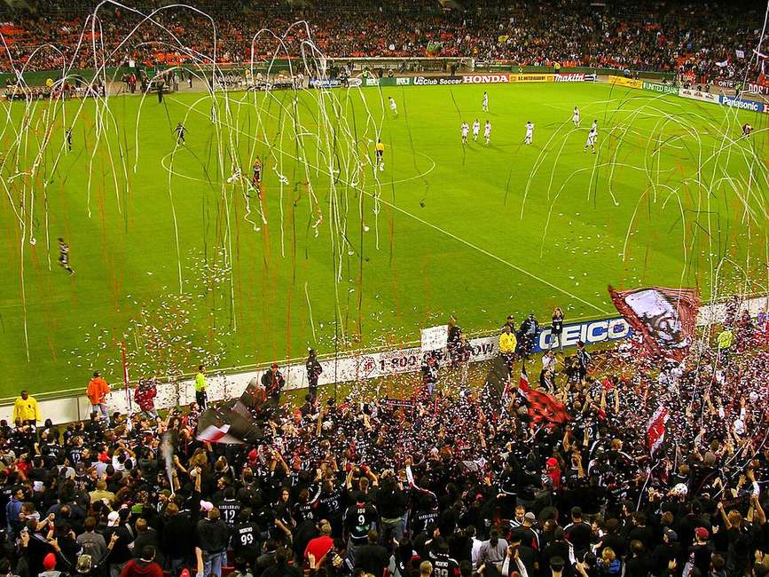 Fans celebrating at a football match