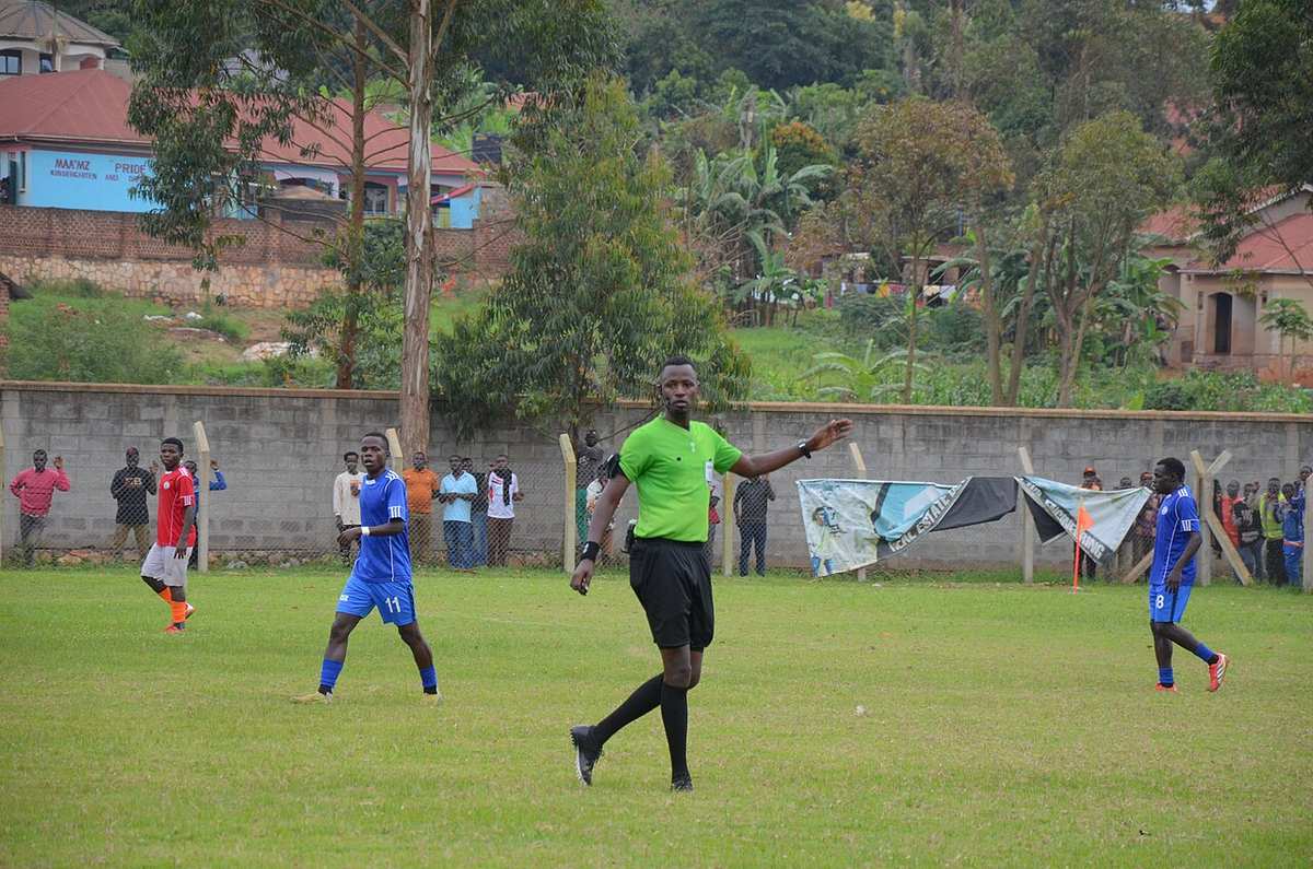 A referee officiating during a football match