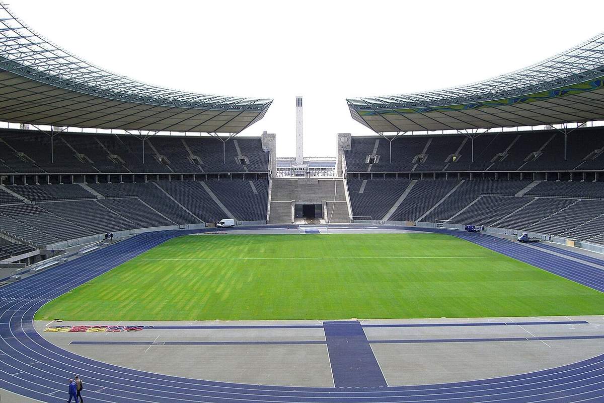 A football pitch inside an Olympic stadium