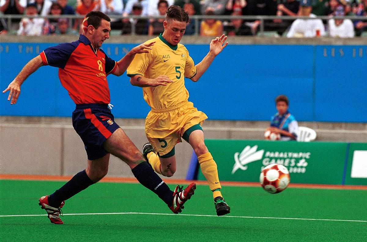 Players contesting the ball during a football match at Sydney 2000
