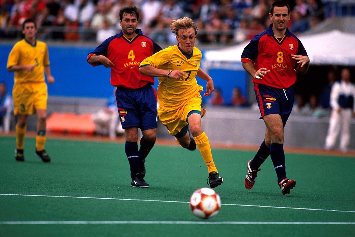 A footballer striking the ball during a match at Sydney 2000