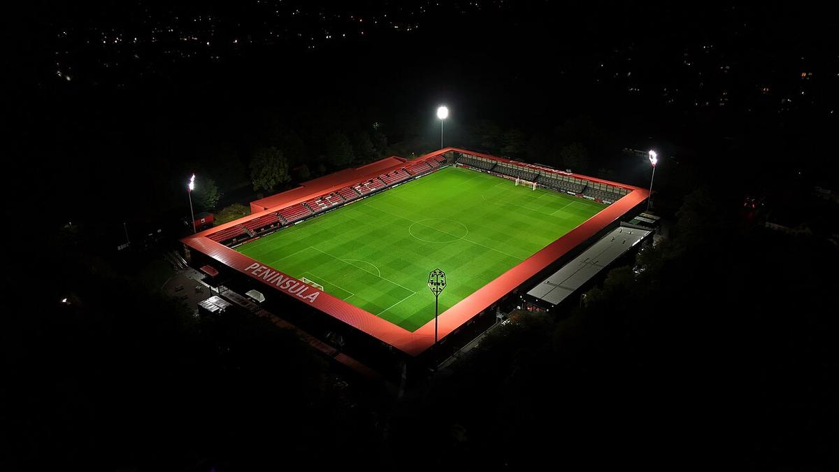 A football stadium lit up at night