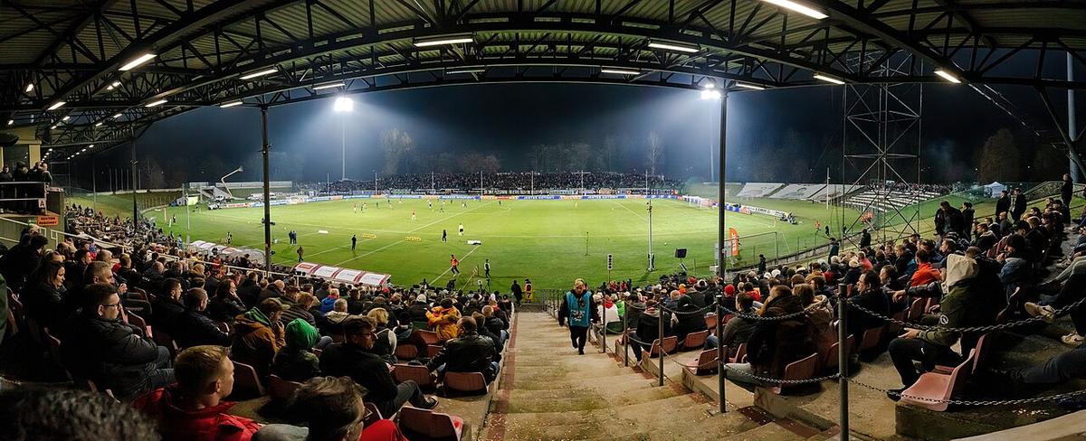 A night match under stadium floodlights